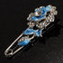 Silver Tone Crystal Rose Safety Pin Brooch (Blue)...