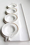 small pierogies, dumplings, uszka press/maker. Makes four small pierogies at once...