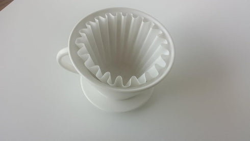 flat-bottom ceramic pour-over coffee dripper....