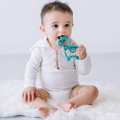 Itzy Ritzy Silicone Baby Teether – BPA-Free Infant Teether with Easy-to-Hold Design and Textured Back Side to Massage and Soothe Sore, Swollen Gum...