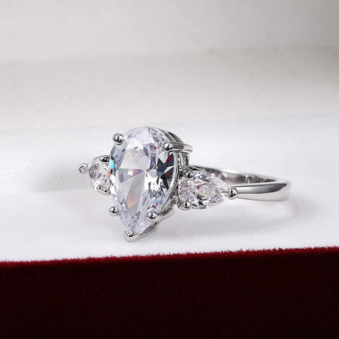 Hsitgexf Shining Classic Plated Silver Pear Cut Teardrop Halo Cubic Zirconia CZ Statement 3-Stone Eternity Wedding Engagement Ring for Women (US s...