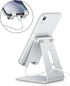 Adjustable Cell Phone Stand, OMOTON Aluminum Desktop Cellphone Stand with Anti-Slip Base and Convenient Charging Port, Fits All Smart Phones, Silv...