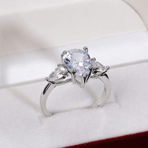 Hsitgexf Shining Classic Plated Silver Pear Cut Teardrop Halo Cubic Zirconia CZ Statement 3-Stone Eternity Wedding Engagement Ring for Women (US s...