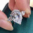 Hsitgexf Shining Classic Plated Silver Pear Cut Teardrop Halo Cubic Zirconia CZ Statement 3-Stone Eternity Wedding Engagement Ring for Women (US s...