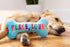 Huxley & Kent for Dogs | Peace, Love, Belly Rubs Bone | Holiday Christmas Power Plush Dog Toy with Squeaker | Funny Dog Gift | Fun, Durable, and S...