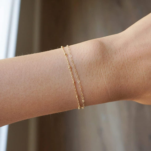 Tasiso Dainty Gold Bracelets for Women Cute Tiny Sideways Cross Bracelets Layered Pearls Herringbone Chain Toggle Clasp Bracelet Minimalist Handma...