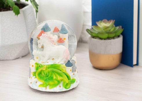 Elanze Designs Castle Unicorn with Green Dragon Tabletop Figurine Decoration 100MM Sturdy Glitter Water Wind Up Musical Snow Globe Plays Tune You ...