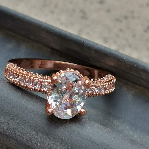 XIALV Rose Gold Plated Cubic Zirconia 2 Carats Oval Cut Ring Simulated Diamond CZ Wedding Engagement Ring for Women (US size 7)...