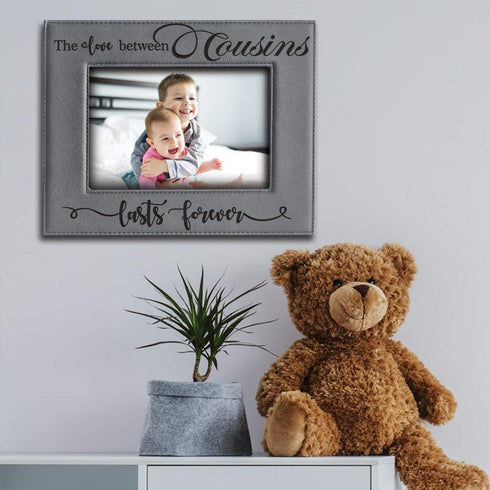 BELLA BUSTA -Cousins-The Love Between Cousins Lasts Forever_Birthday, Christmas gift for Cousin -Engraved Leather Picture Frame (5 x 7 Horizontal)...
