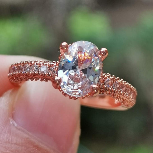 XIALV Rose Gold Plated Cubic Zirconia 2 Carats Oval Cut Ring Simulated Diamond CZ Wedding Engagement Ring for Women (US size 7)...