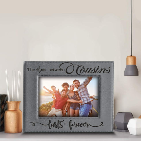 BELLA BUSTA -Cousins-The Love Between Cousins Lasts Forever_Birthday, Christmas gift for Cousin -Engraved Leather Picture Frame (5 x 7 Horizontal)...