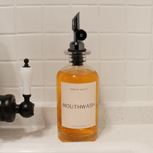 Mouthwash Dispenser for Bathroom, Clear Glass Mouth Wash Container with Stainless Steel Pour Spout, Refillable Mouthwash Bottle with Waterproof La...