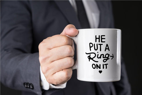 AW Fashions He Put a Ring On It - Funny Engagement Mug - 11OZ Coffee Mug - Mugs For Bride or Fiance - Perfect for Engagement or Wedding (White)...