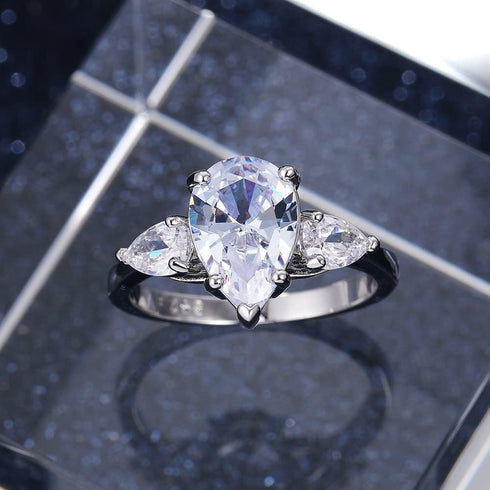 Hsitgexf Shining Classic Plated Silver Pear Cut Teardrop Halo Cubic Zirconia CZ Statement 3-Stone Eternity Wedding Engagement Ring for Women (US s...