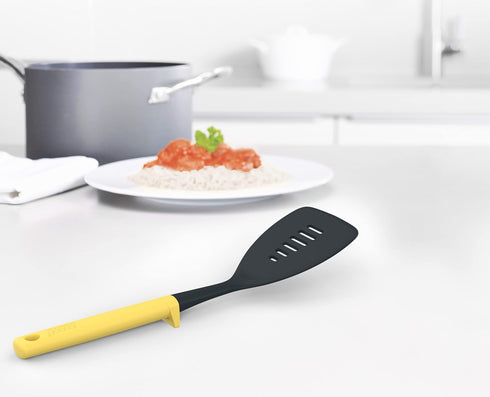 Joseph Joseph Duo Slotted Turner with Integrated Tool Rest: Hygienic, Heat-Resistant Nylon Head, Safe for Non-Stick Cookware, Light Yellow...