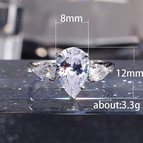 Hsitgexf Shining Classic Plated Silver Pear Cut Teardrop Halo Cubic Zirconia CZ Statement 3-Stone Eternity Wedding Engagement Ring for Women (US s...
