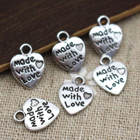 100pcs Heart Shape Charms Pendants Made with Love Letters Carving DIY Craft Necklace Bracelets Keychain Jewelry Making Findings Accessories (Ancie...