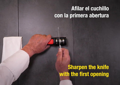 Arcos Sharpeners Manual Knife Sharpener tool. Made of ABS + TPE. Carbide and Ceramic Rollers. Keep Your Knives Razor Sharp. Black and Red Color...