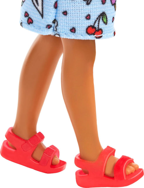 Barbie Chelsea Doll, Small Doll Wearing Removable Blue Dress with Colorful Print & Pink Shoes, Brown Hair & Green Eyes...
