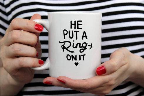AW Fashions He Put a Ring On It - Funny Engagement Mug - 11OZ Coffee Mug - Mugs For Bride or Fiance - Perfect for Engagement or Wedding (White)...