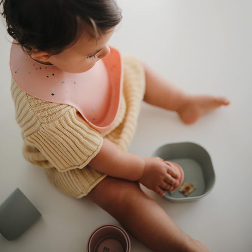 mushie Silicone Baby Bib | Adjustable Fit Waterproof Bibs (Powder Pink Confetti)...