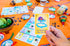 Baby Shower Bingo Kit - Bilingual English Spanish, for 20 Players - Includes 1 Deck of Cards and Boards - with 240 Markers - for The Entire Family...