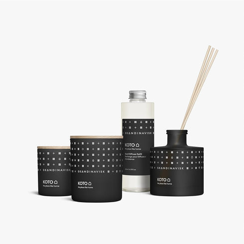 Skandinavisk KOTO 'Home' Mini Scented Candle. Fragrance Notes: Vanilla Beans and Dried Orange Peel, Amber and Leather. 2.3 oz....