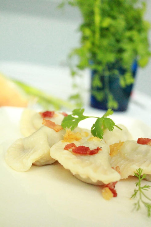small pierogies, dumplings, uszka press/maker. Makes four small pierogies at once...