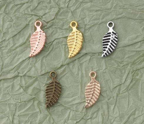 50 Pcs Leaf Charm Beads Metal Small 1.4 x 0.6 cm Tree Leaves Pendants for Crafting Jewelry Making Kit Findings Necklace Bracelet DIY Decoration Su...