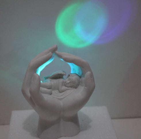 Sleeping Resting Angel in God's Hand with Colorful Light Fairy Garden Deco Cupid Statue Home Deco Cherub Statue Baby Sculpture Figurine Memorial...