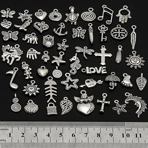 RUBYCA 200Pcs Bulk Mixed Silver Charms for Jewelry Making Bracelet Small Pendants for Necklace Antiqued Silver Color - Just Like the Picture (Mix2...