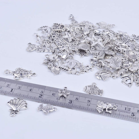 BronaGrand 100pcs Mixed Antique Silver DIY Ocean Fish & Sea Creatures Charms Pendants for Making Bracelet and Necklace...