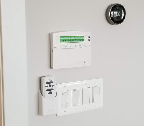 The No-Screwups Remote Control Holder by Mount Genie (White): Wall Mount with No Damaging Screws or Tape. Installs in seconds on any light switch....