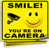 iSYFIX Smile You're On Camera Stickers for Home - 4 Pack 7x6 Inch - Decals for Inside the Window or Glass, UV, Weather, Scratch, Fade Resistance, ...