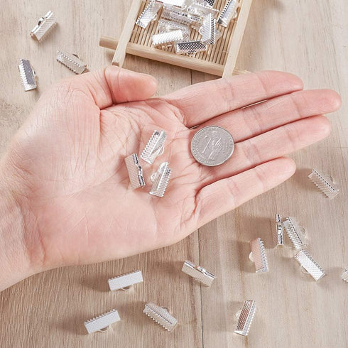 Craftdady Silver Ribbon Ends 50Pcs Bookmark Pinch Crimp Clamp Cord End Fastener Clasps with 1mm Loop for Leather Suede Jewelry Making 16x8mm...