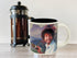 The Unemployed Philosophers Guild Bob Ross Heat Changing Mug - Add Coffee or Tea and a Happy Little Scene Appears - Comes in a Fun Gift Box...