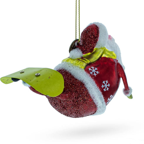 Santa Snowboarding Blown Glass Christmas Ornament...