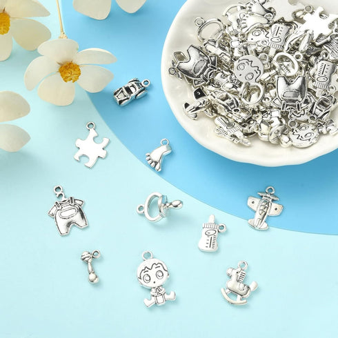Ipotkitt 100 Pcs 10 Styles Antique Style Cartoon Charms Baby Boy Charms Baby Themed Puzzle Plane Charms for Baby Shower DIY Jewelry Making Supplie...