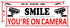 Smile You're on Camera Sign, 2 Pack Video Surveillance Sign, 10" x 3.5" Home Security Signs for House Business, Metal Camera Warning Sign Outdoor,...