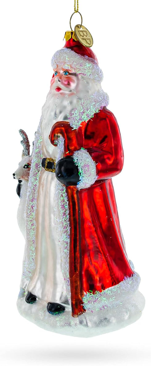 Santa Guided by White Reindeer Glass Christmas Ornament...