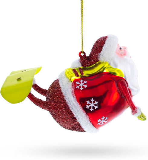 Santa Snowboarding Blown Glass Christmas Ornament...