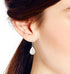 AeraVida Elegant Teardrop White Mother of Pearl Inlay Sterling Silver Dangle Earrings...