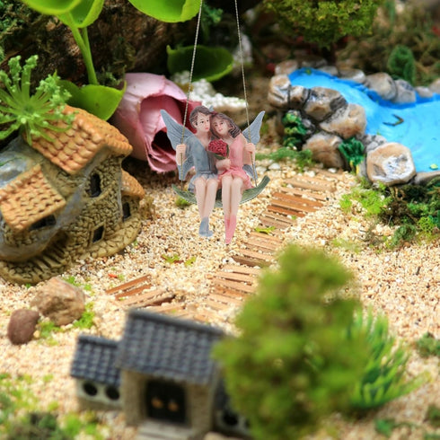 GANAZONO Couples Garden Flower Fairy Statue Garden Fairy Figurine Fairy Girl and Boy Sitting on Swing Sculpture for Garden Hanging Decor Ornament...