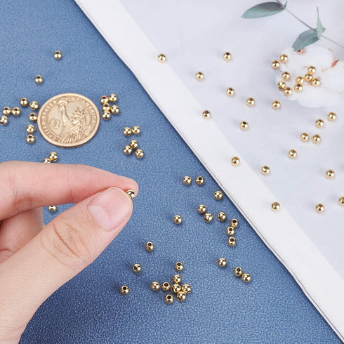 PH PandaHall 300pcs 4mm 14K Gold Plated Beads Mini Round Jewelry Beads Waist Loose Bead Smooth Metal Brass Bead for Friendship Bracelet Bikini Bel...