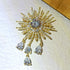 Fantastic Gold Tone Atomic CZ and Pearl Beads Starburst Brooch with Trio Drop...
