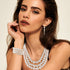 FINREZIO Women's Faux Three Multi-Strand Pearl Necklace Long Pearl Dangle Earrings and Bracelet Jewelry Set for Women...