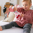 HABA Snug Up Doll Rumbi - 10" Soft Doll with Black Hair and Pink Overalls - Machine Washable for 18 Months and Up...