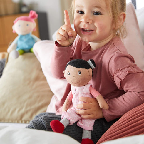 HABA Snug Up Doll Rumbi - 10" Soft Doll with Black Hair and Pink Overalls - Machine Washable for 18 Months and Up...