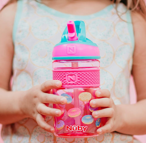 Nuby Thirsty Kids Flip-it Freestyle On the Go Water Bottle with Bite Resistant Hard Straw Cup and Easy Grip Band, Pink Donuts, 12 Ounce...
