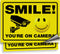 iSYFIX Smile You're on Camera Reflective Stickers for Business - 2 Pack 14x10 Inch - Self-Adhesive Vinyl Decal, Laminated for UV Protection, Fade ...